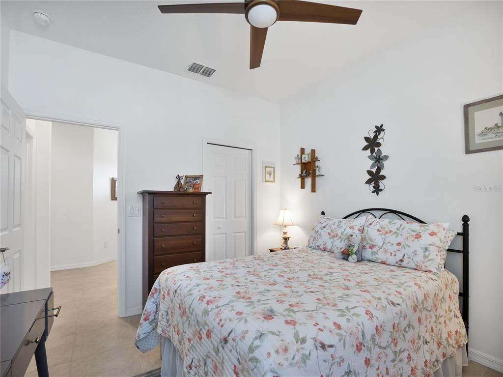 7832 Southwest 86th Loop Ocala, FL 34476 - Photo 8 of 40 a bedroom with a bed and a closet