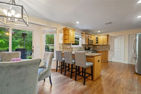 a view of a dining room with furniture window and outside view