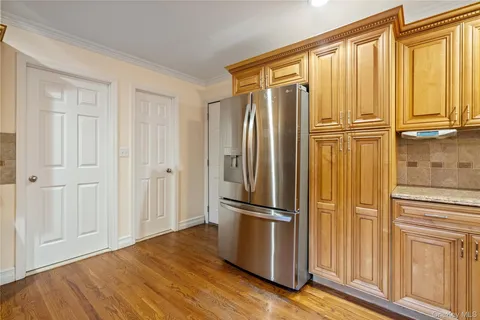 a view of wooden floor and windows in a room