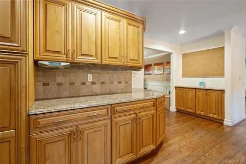 a view of cabinets and wooden floor