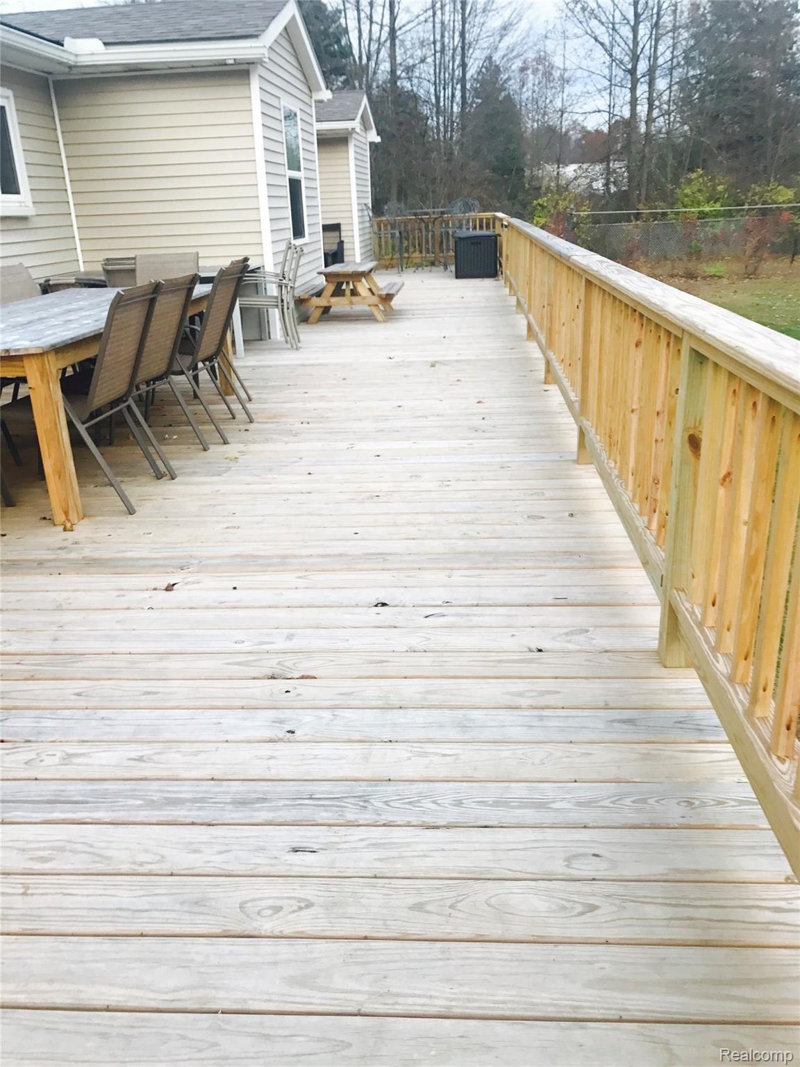 46645 Wear Road Belleville, MI 48111 - Photo 10 of 62 Huge Wood Deck "57x 14" (2019) that spans entire length of home.