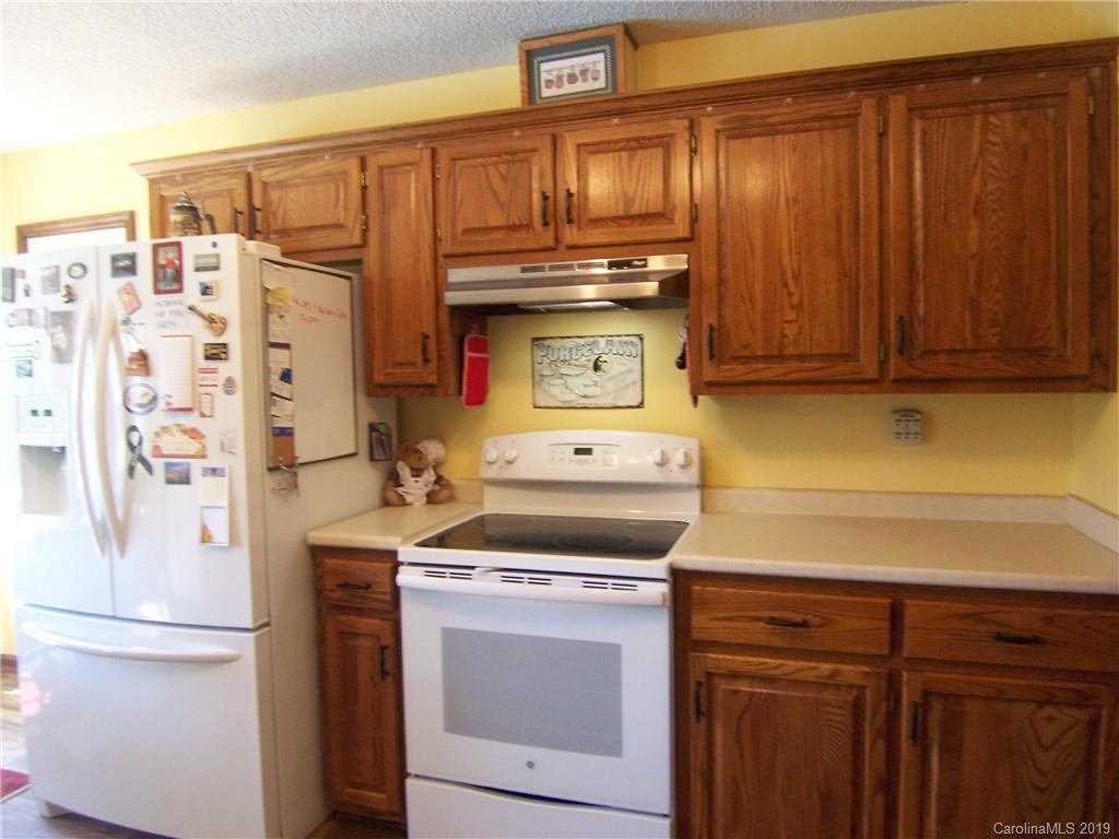 124 Laren Road Shelby, NC 28152 - Photo 12 of 30 a kitchen with stainless steel appliances a stove and a refrigerator