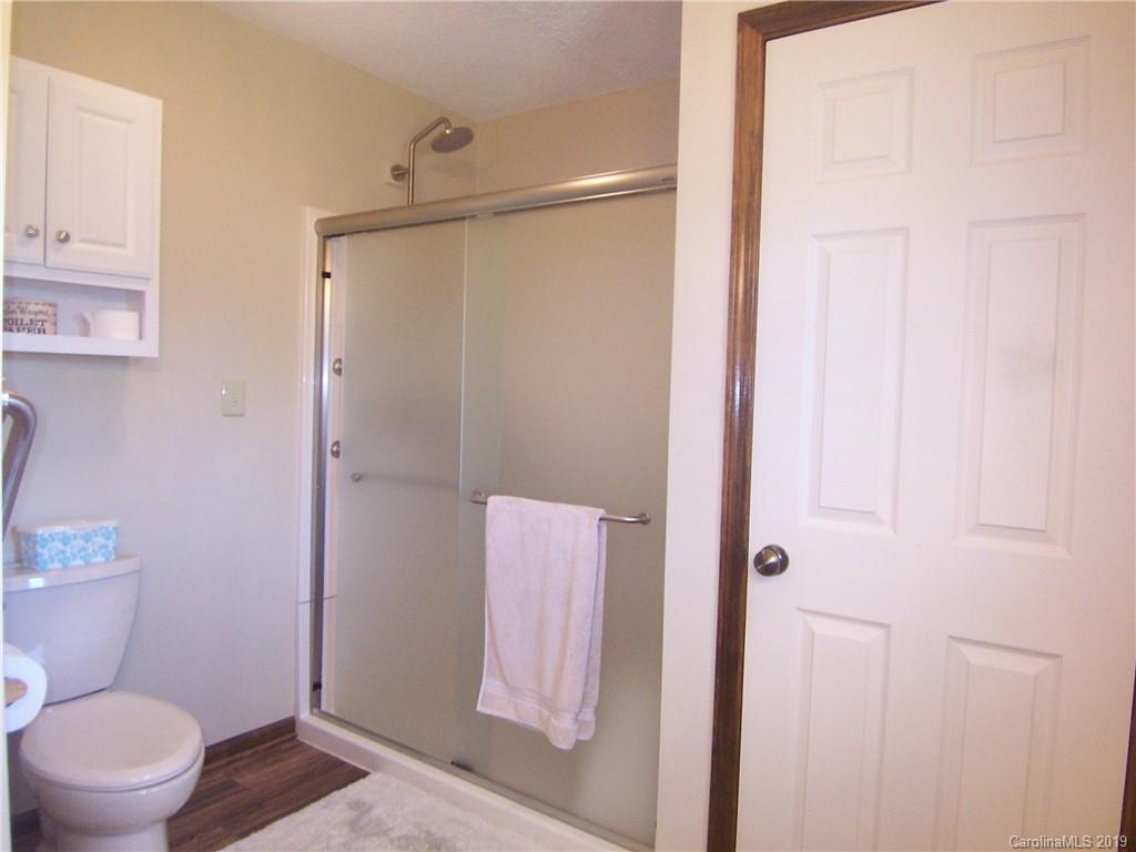 124 Laren Road Shelby, NC 28152 - Photo 17 of 30 a bathroom with a shower and a toilet