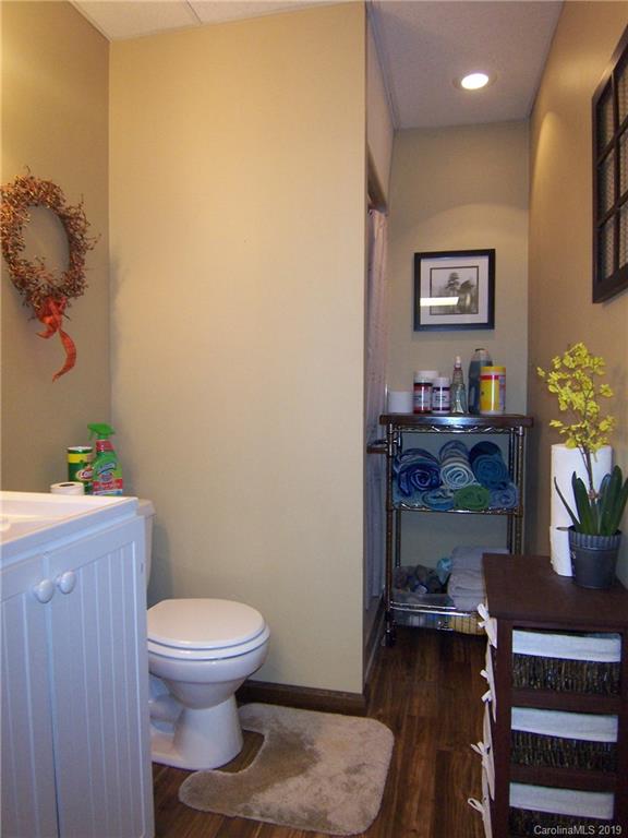 124 Laren Road Shelby, NC 28152 - Photo 22 of 30 a bathroom with a toilet a sink and a mirror