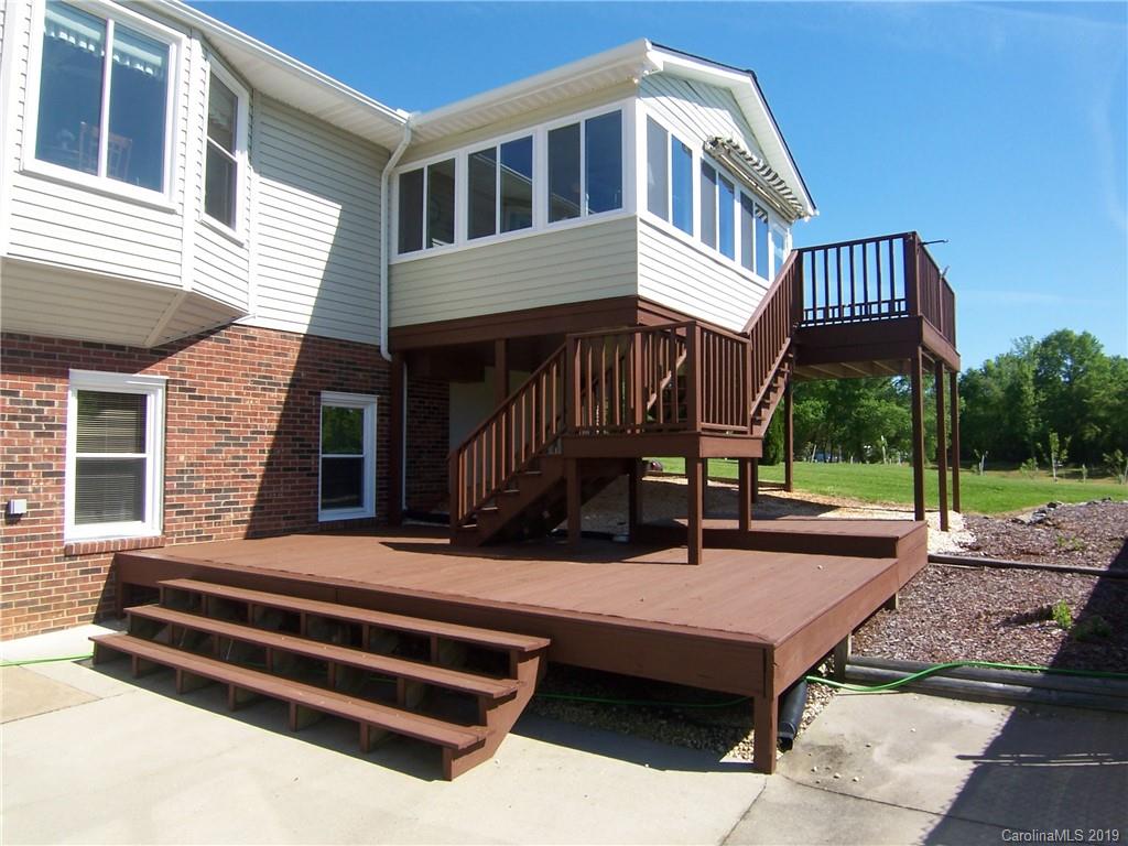 124 Laren Road Shelby, NC 28152 - Photo 25 of 30 a backyard of a house with barbeque oven table and chairs