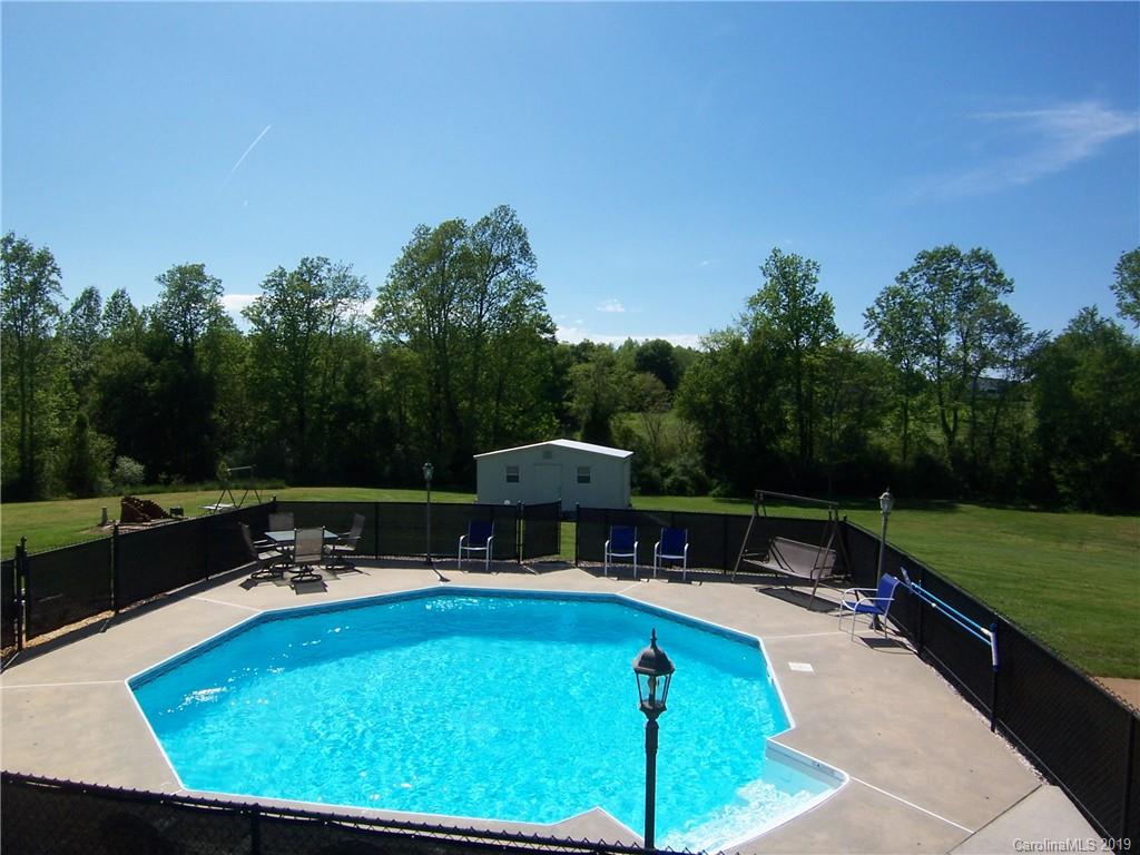 124 Laren Road Shelby, NC 28152 - Photo 28 of 30 a view of a swimming pool with a patio and a garden