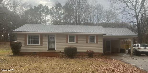 a front view of a house with parking space