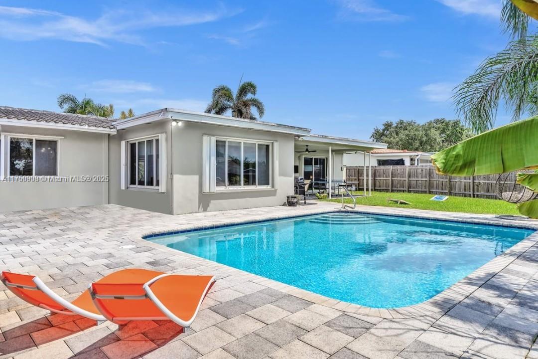4316 Garfield Street Hollywood, FL 33021 - Photo 1 of 36 a view of a house with swimming pool and porch