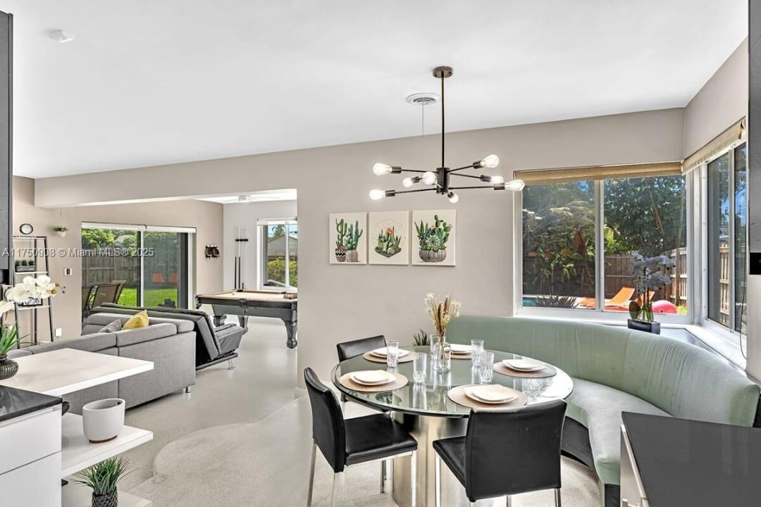 4316 Garfield Street Hollywood, FL 33021 - Photo 13 of 36 a view of a dining room with furniture window and outside view