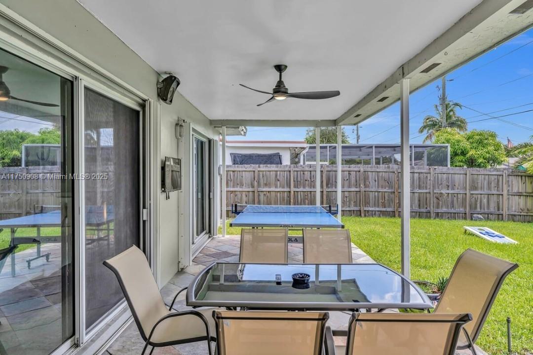 4316 Garfield Street Hollywood, FL 33021 - Photo 21 of 36 a view of a dining room with furniture window and wooden floor