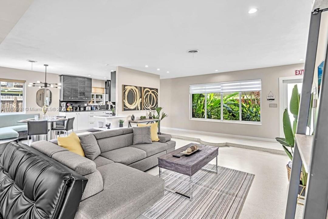 4316 Garfield Street Hollywood, FL 33021 - Photo 23 of 36 a living room with furniture and a flat screen tv