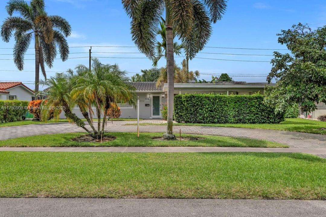 4316 Garfield Street Hollywood, FL 33021 - Photo 32 of 36 a front view of a house with a yard