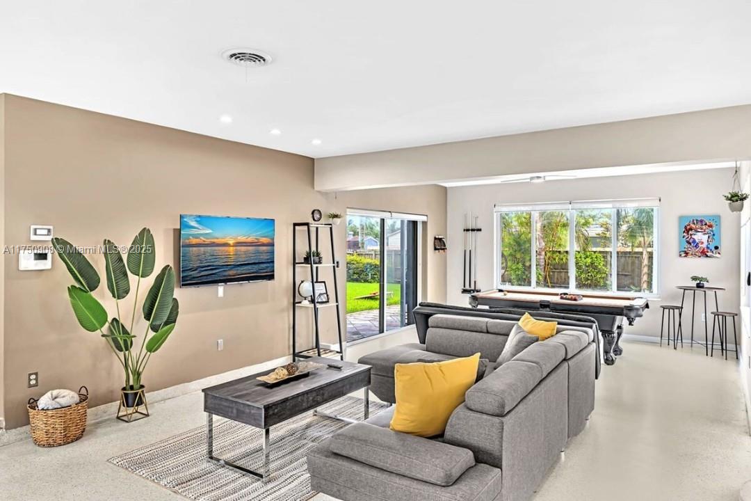 4316 Garfield Street Hollywood, FL 33021 - Photo 35 of 36 a living room with furniture and a window