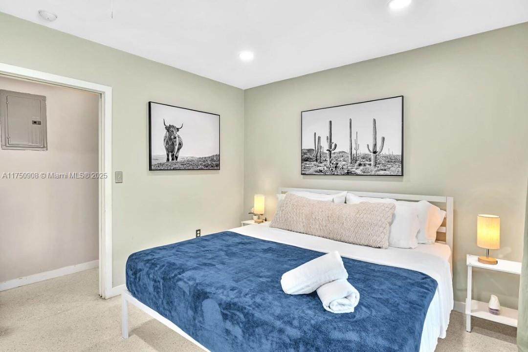 4316 Garfield Street Hollywood, FL 33021 - Photo 9 of 36 a bed room with a bed and a couch