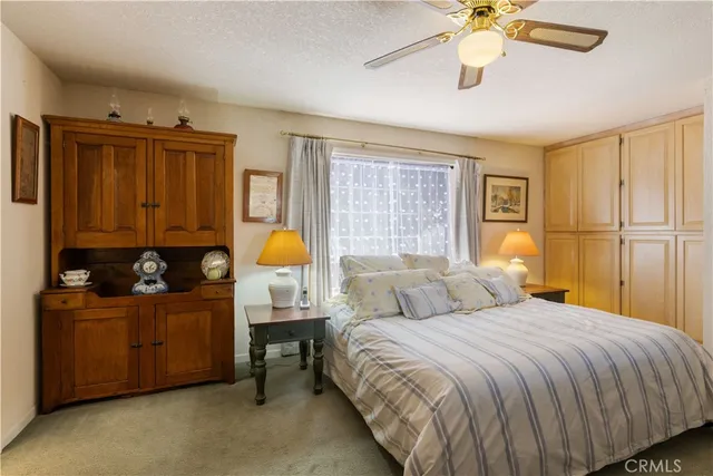 a spacious bedroom with a bed and a window