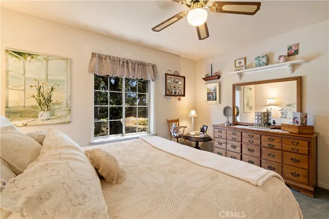 a bathroom with a toilet a sink and a mirror