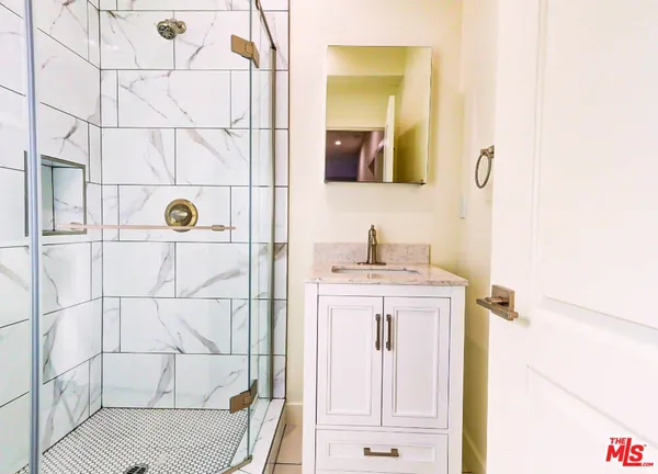 a bathroom with a sink and mirror