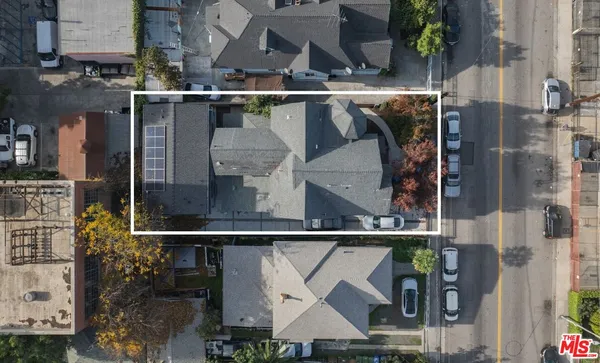 an aerial view of houses and roads
