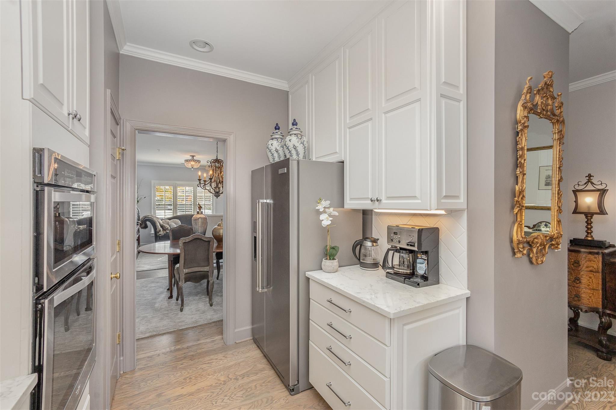 331 Sloane Square Way Charlotte, NC 28211 - Photo 11 of 28 a kitchen with a refrigerator sink and cabinets