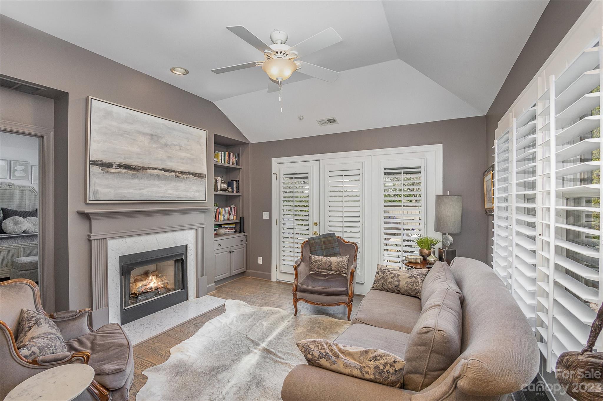 331 Sloane Square Way Charlotte, NC 28211 - Photo 14 of 28 a living room with furniture a fireplace and a large window