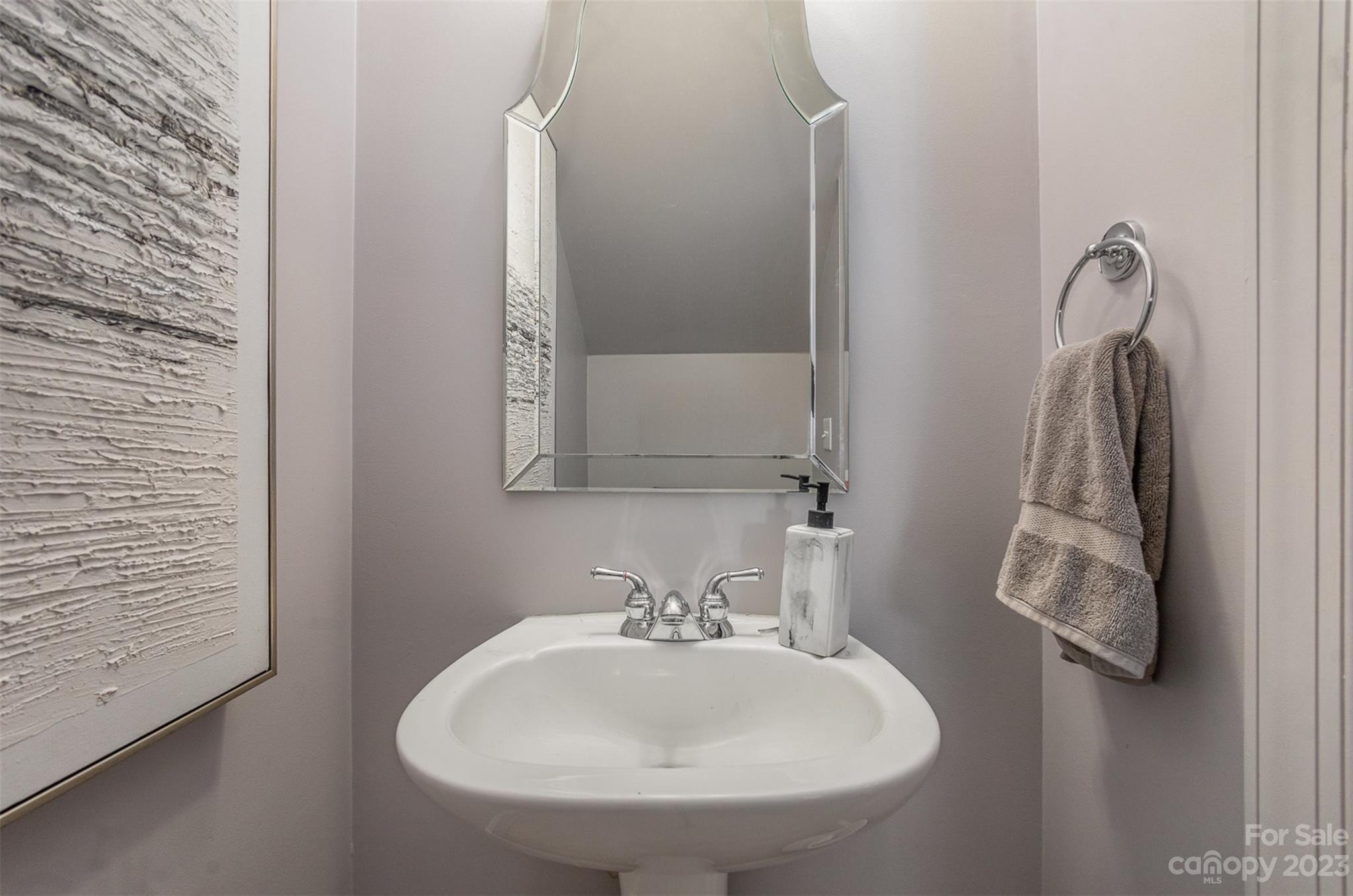 331 Sloane Square Way Charlotte, NC 28211 - Photo 15 of 28 a bathroom with a sink and a mirror