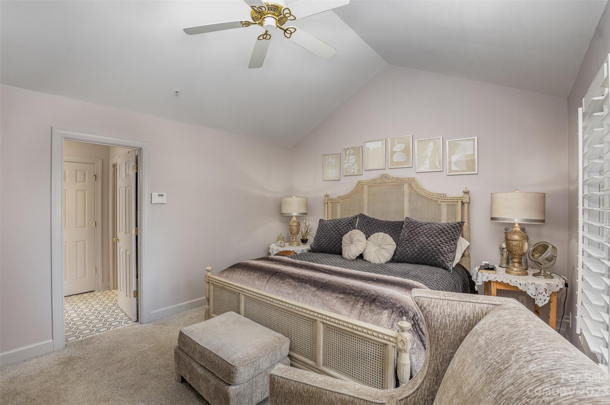331 Sloane Square Way Charlotte, NC 28211 - Photo 17 of 28 a bedroom with a bed and a chandelier