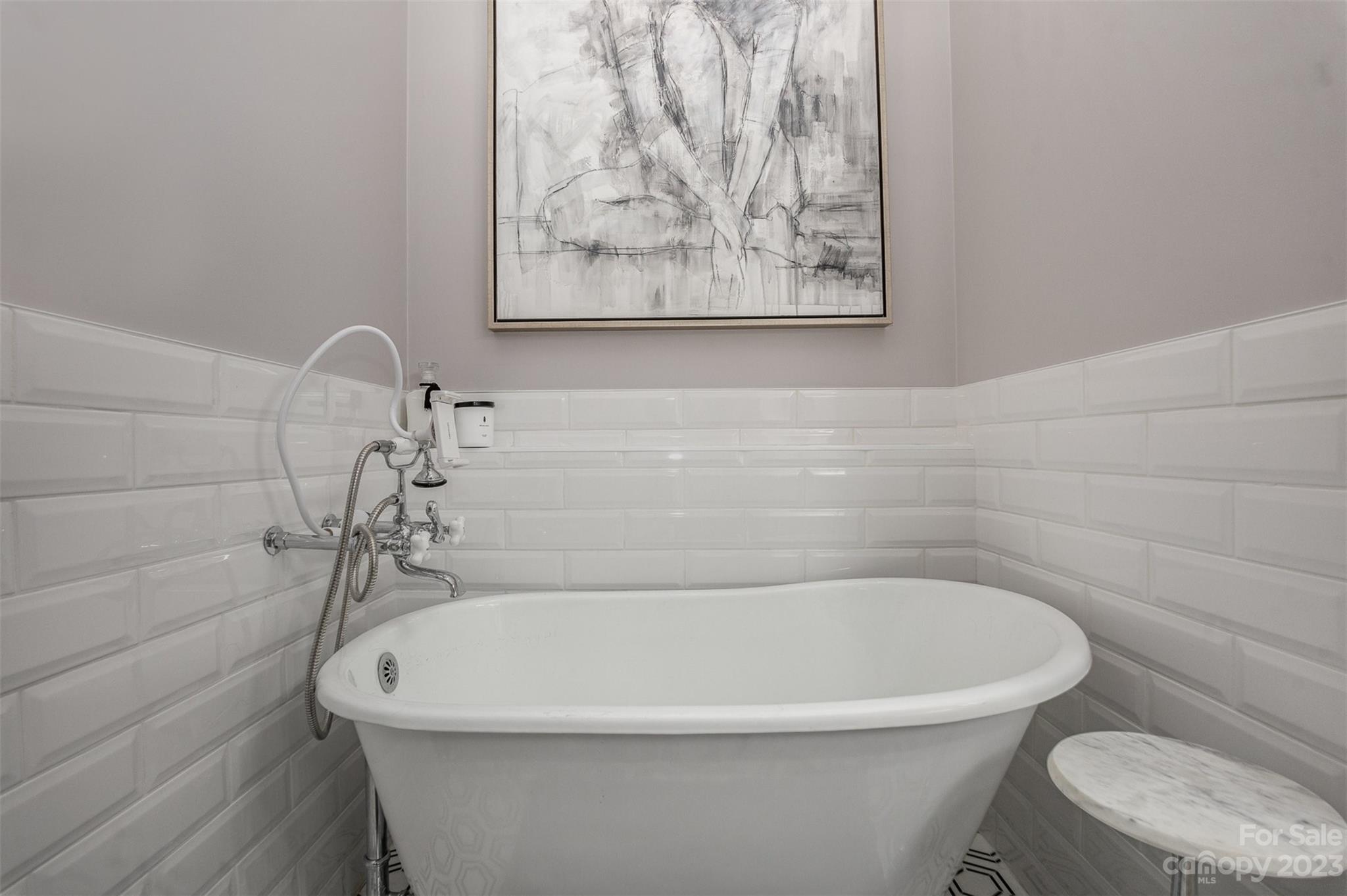 331 Sloane Square Way Charlotte, NC 28211 - Photo 21 of 28 a white bath tub sitting in a bathroom