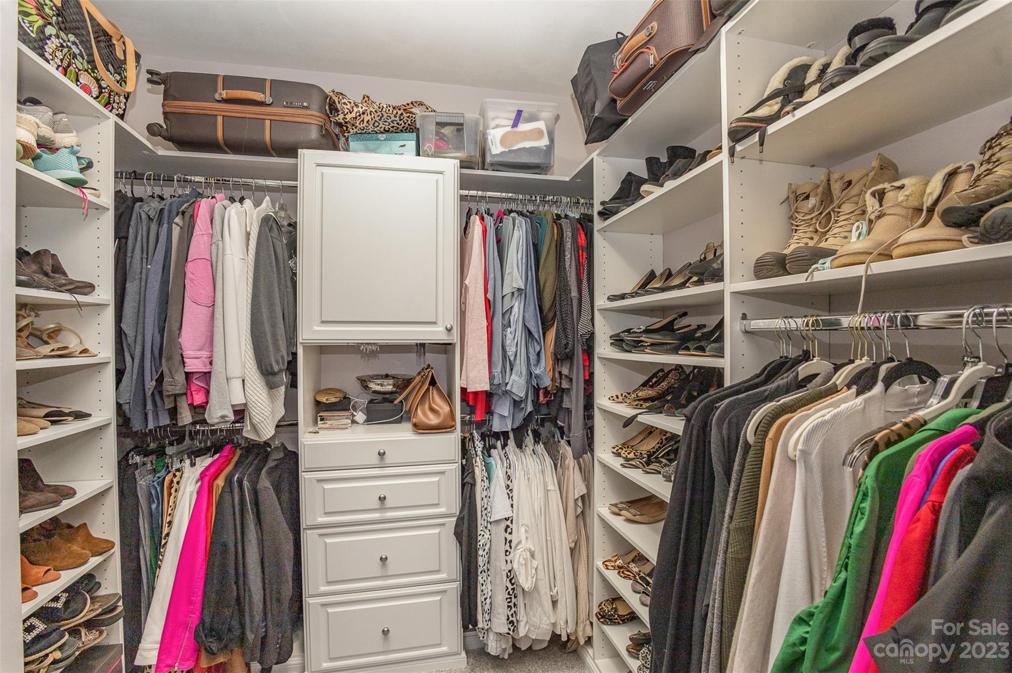 331 Sloane Square Way Charlotte, NC 28211 - Photo 22 of 28 a view of walk in closet with clothes and shoes
