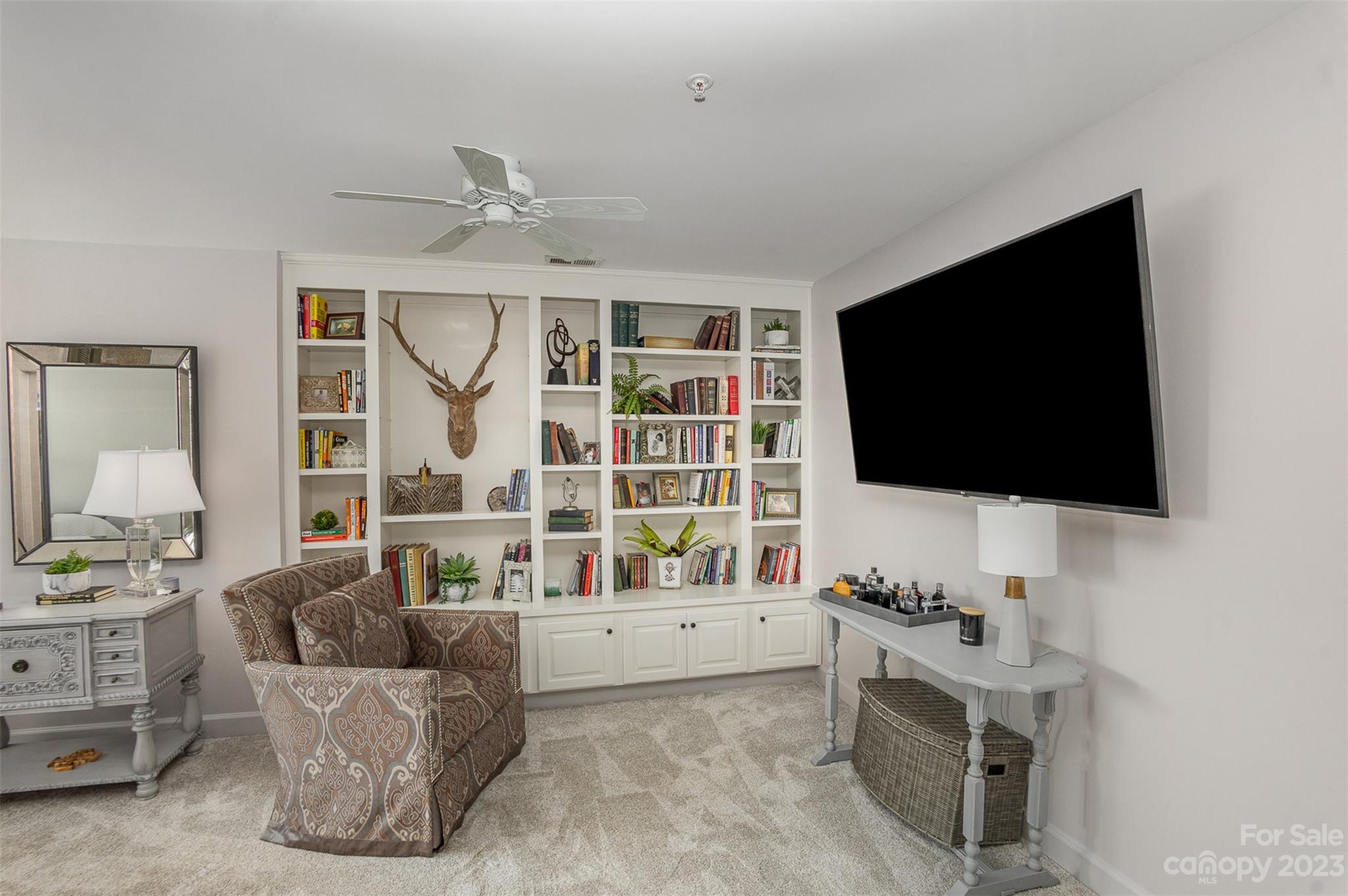 331 Sloane Square Way Charlotte, NC 28211 - Photo 23 of 28 a living room with furniture and a flat screen tv