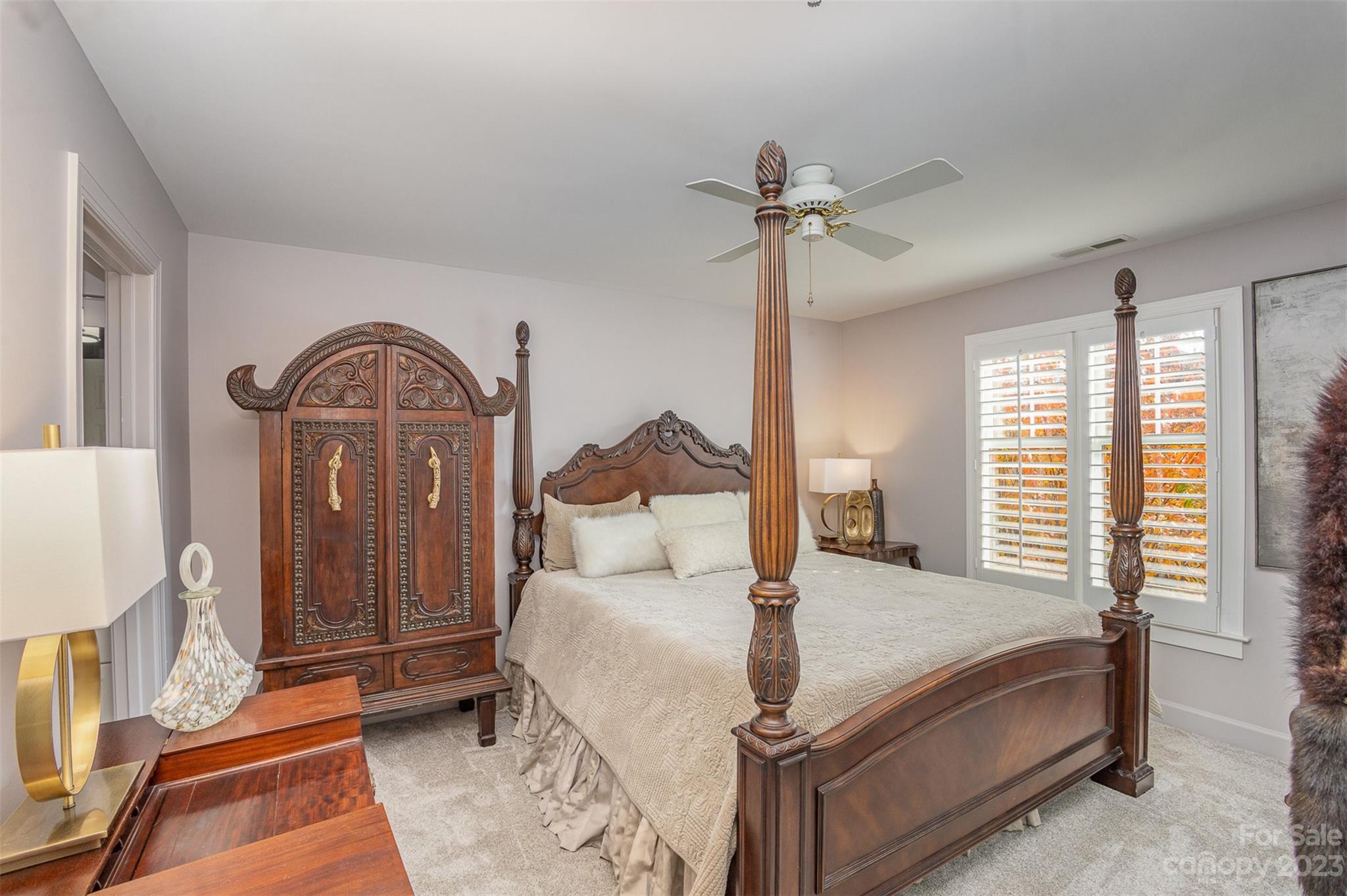 331 Sloane Square Way Charlotte, NC 28211 - Photo 25 of 28 a bedroom with a large bed and a chandelier