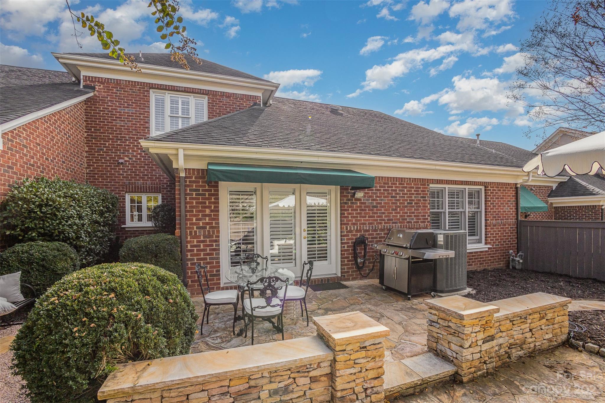 331 Sloane Square Way Charlotte, NC 28211 - Photo 5 of 28 a view of house with backyard outdoor seating and barbeque oven