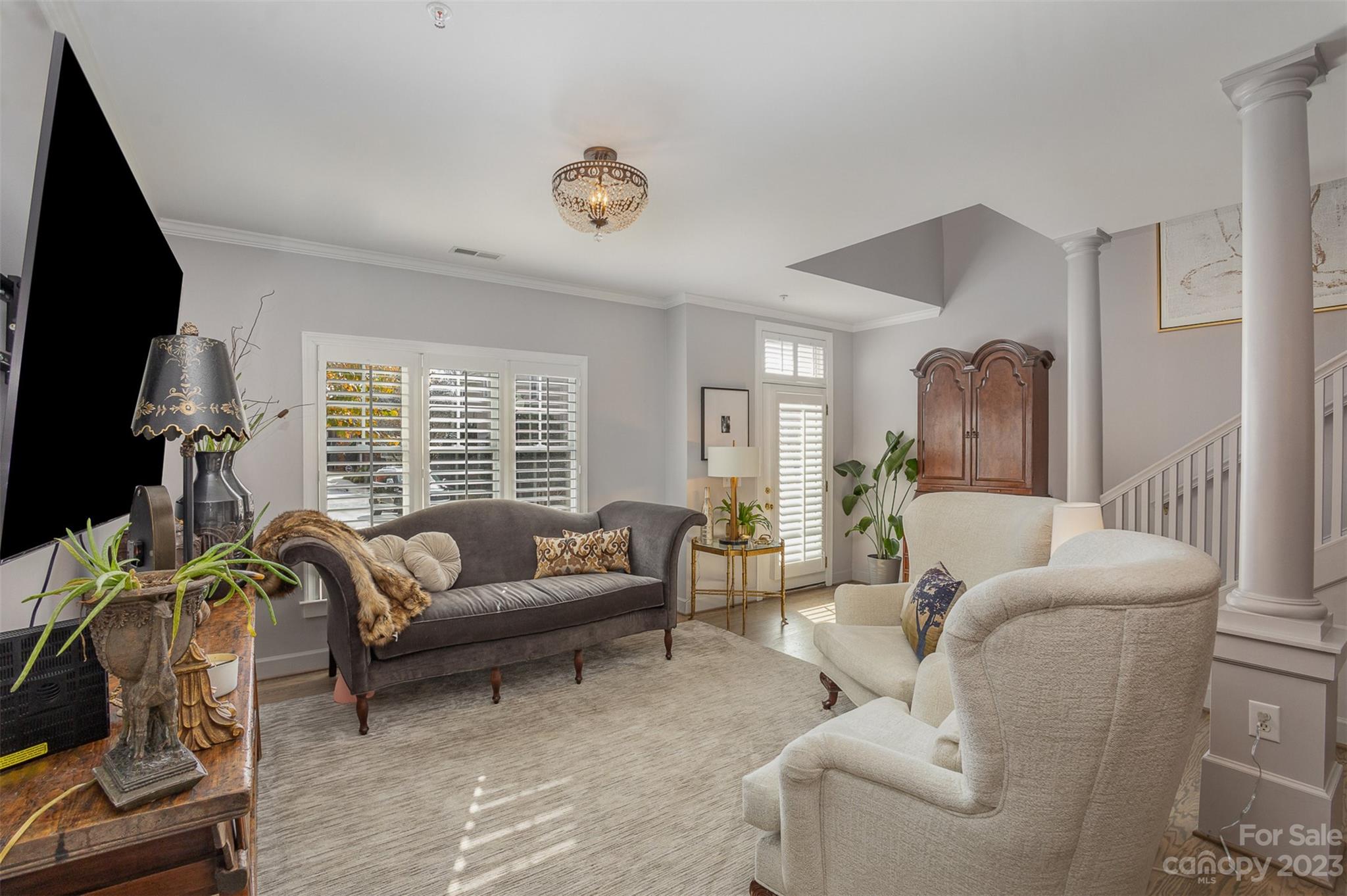 331 Sloane Square Way Charlotte, NC 28211 - Photo 7 of 28 a living room with furniture and a flat screen tv