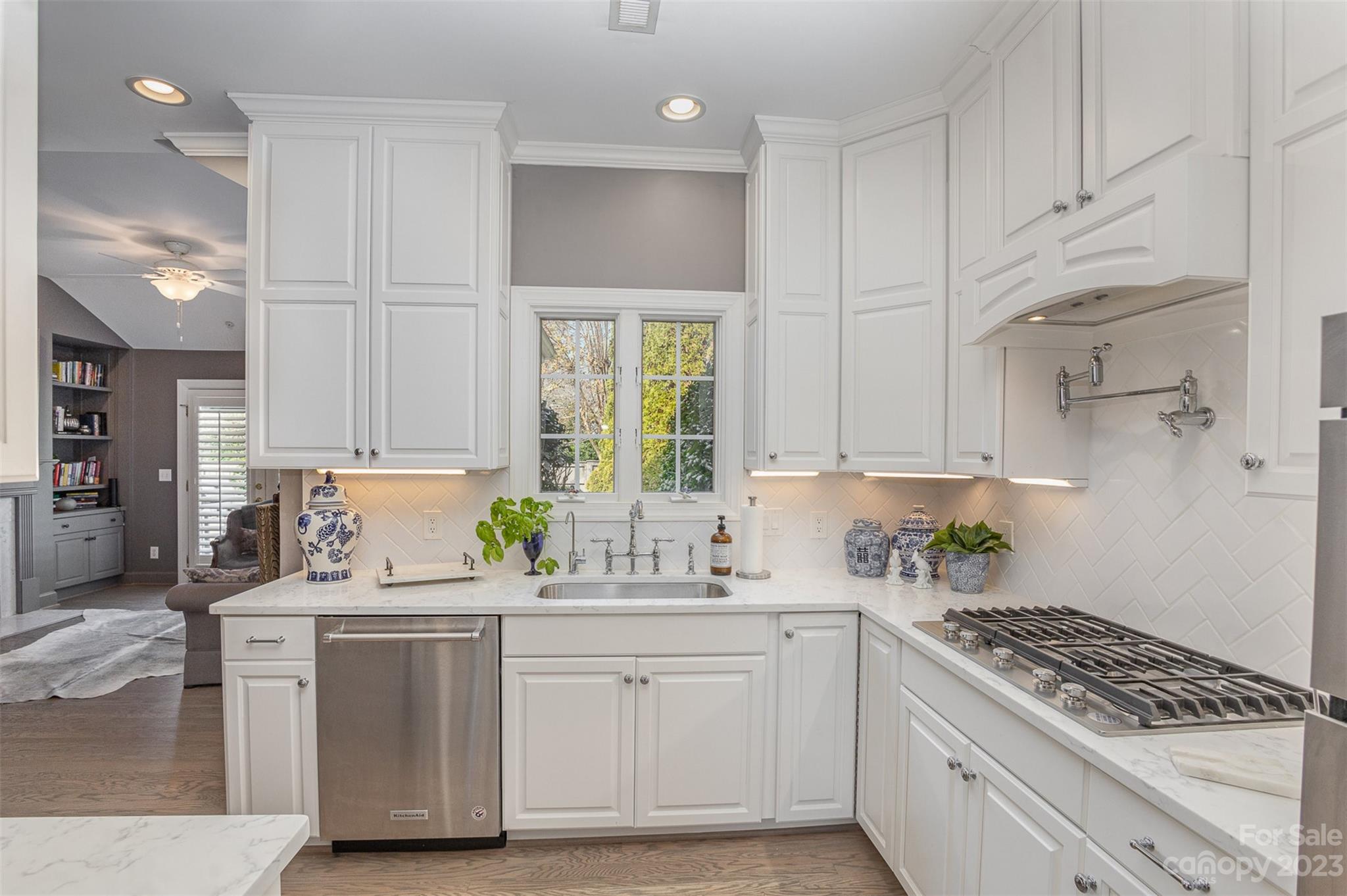 331 Sloane Square Way Charlotte, NC 28211 - Photo 10 of 28 a kitchen with white cabinets and appliances