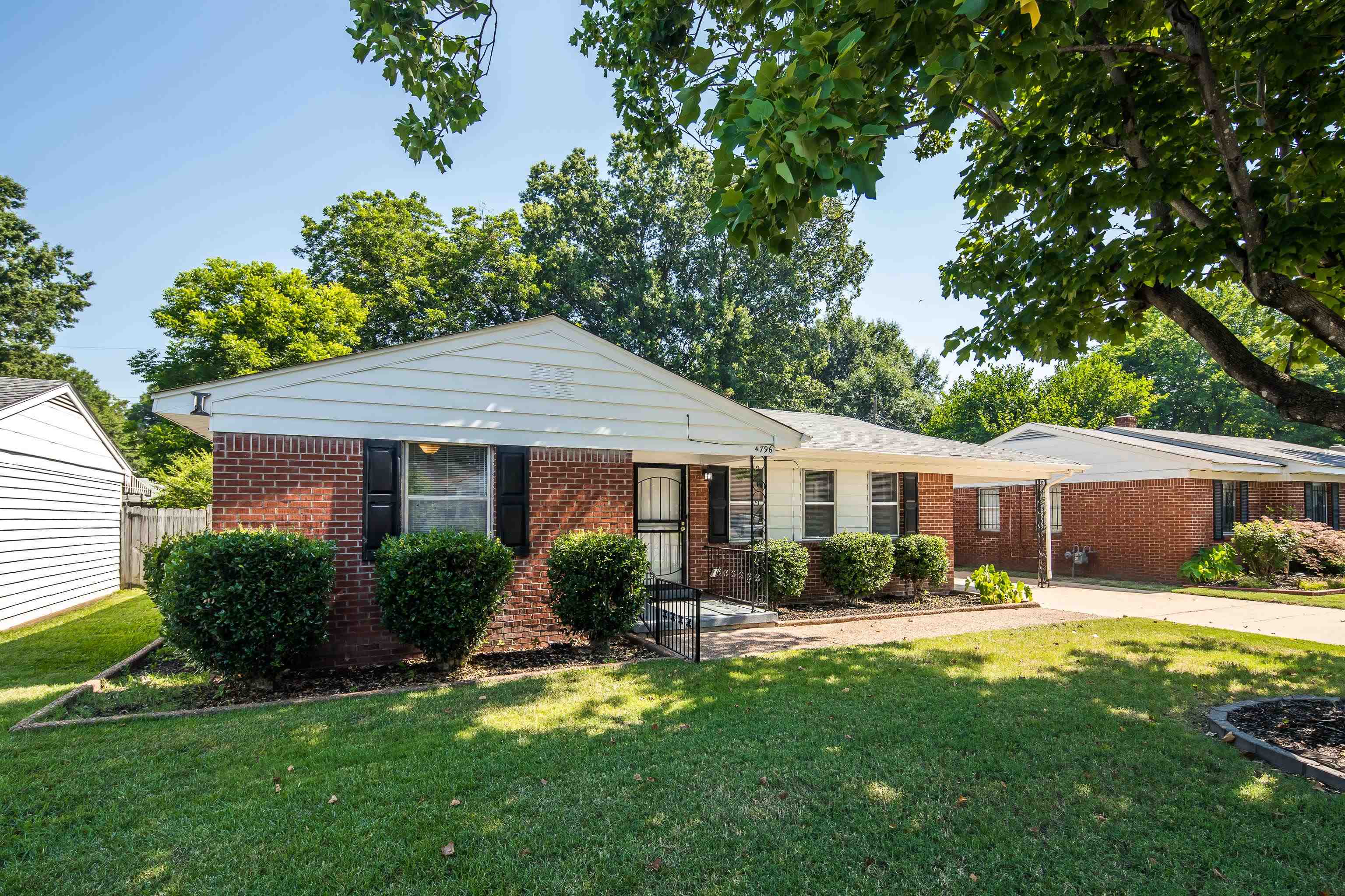 4796 Quince Road Memphis, TN 38117 - Photo 1 of 22 a view of a house with a yard and potted plants