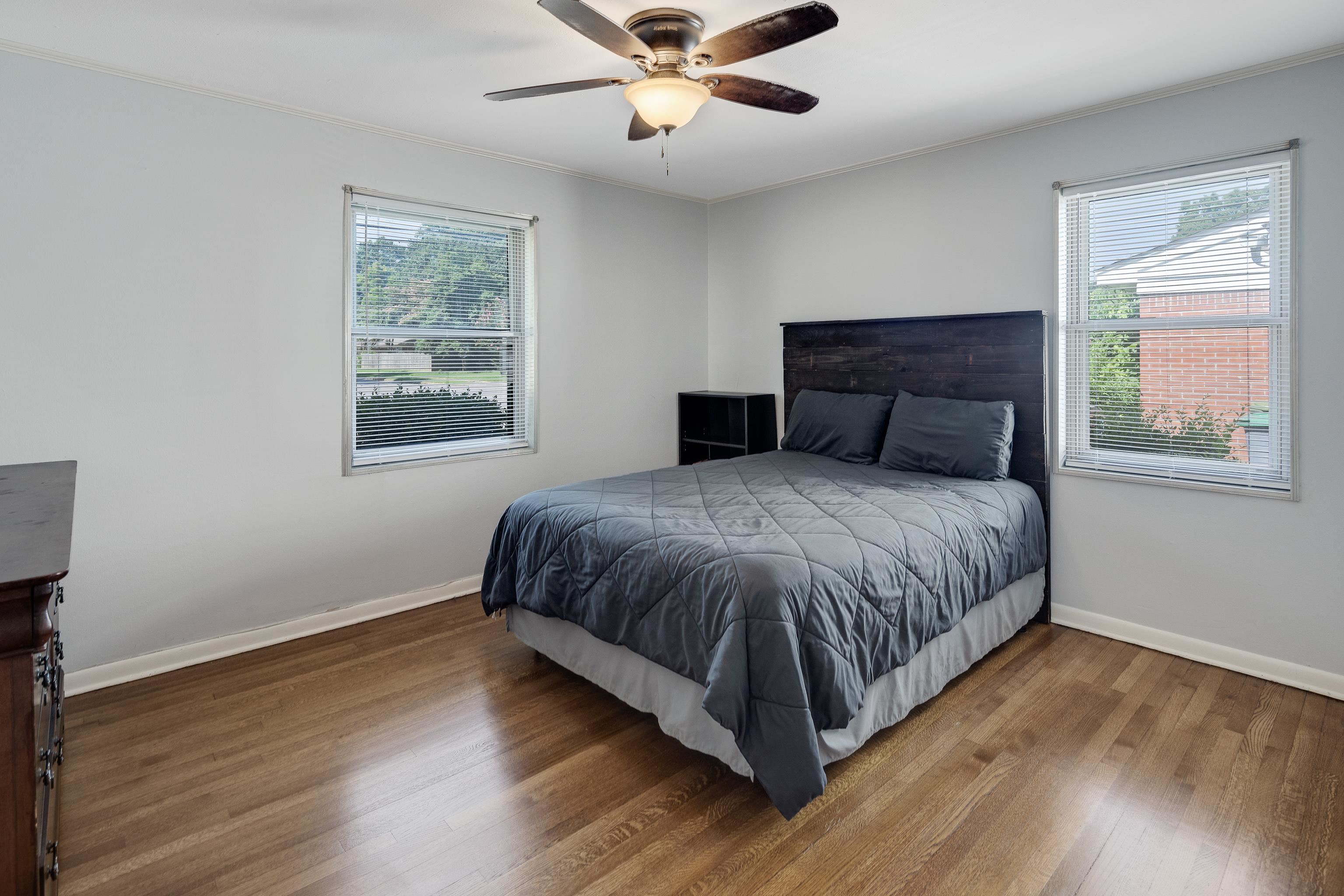 4796 Quince Road Memphis, TN 38117 - Photo 12 of 22 a spacious bedroom with a large bed and a window