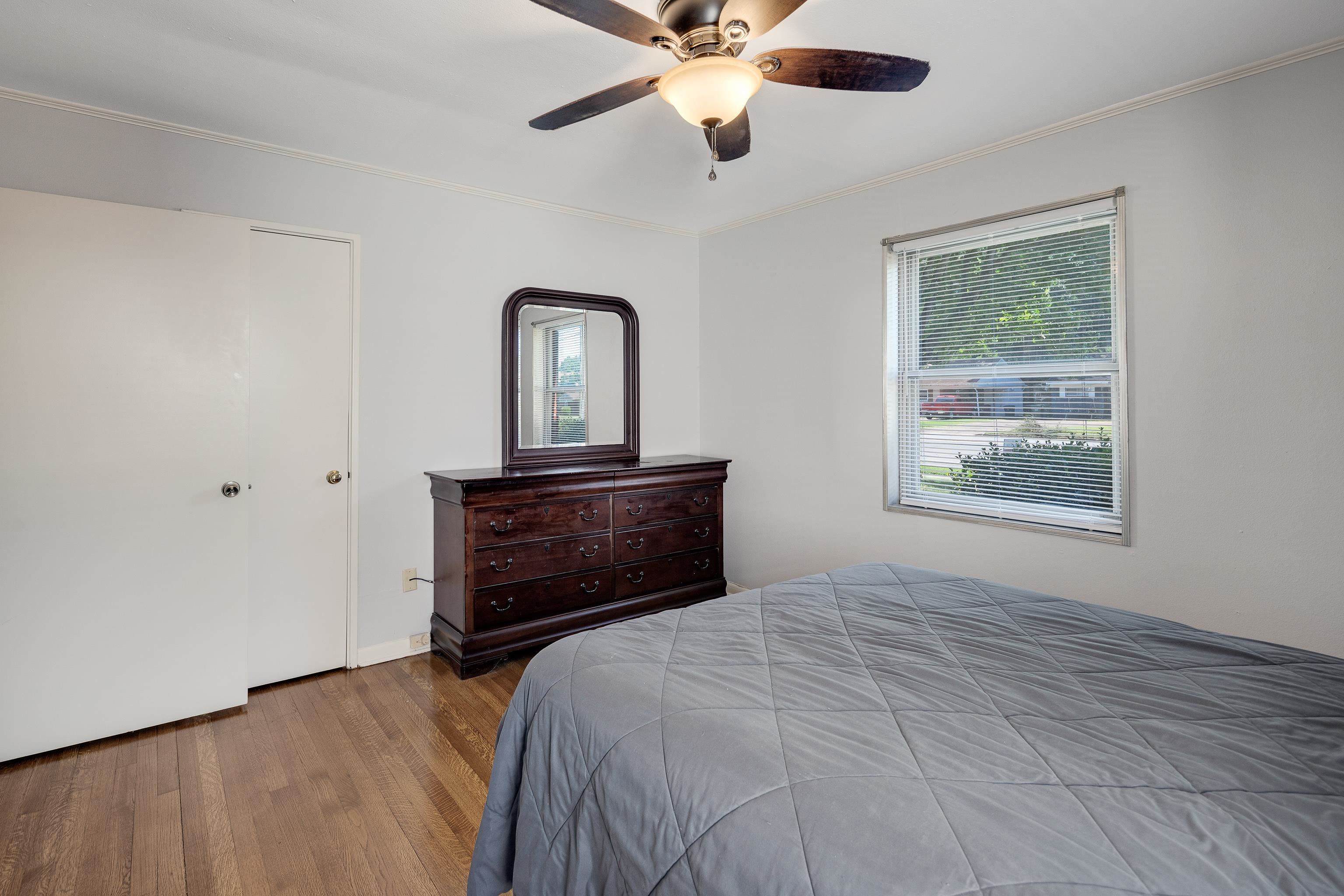 4796 Quince Road Memphis, TN 38117 - Photo 13 of 22 a bedroom with a bed and a window