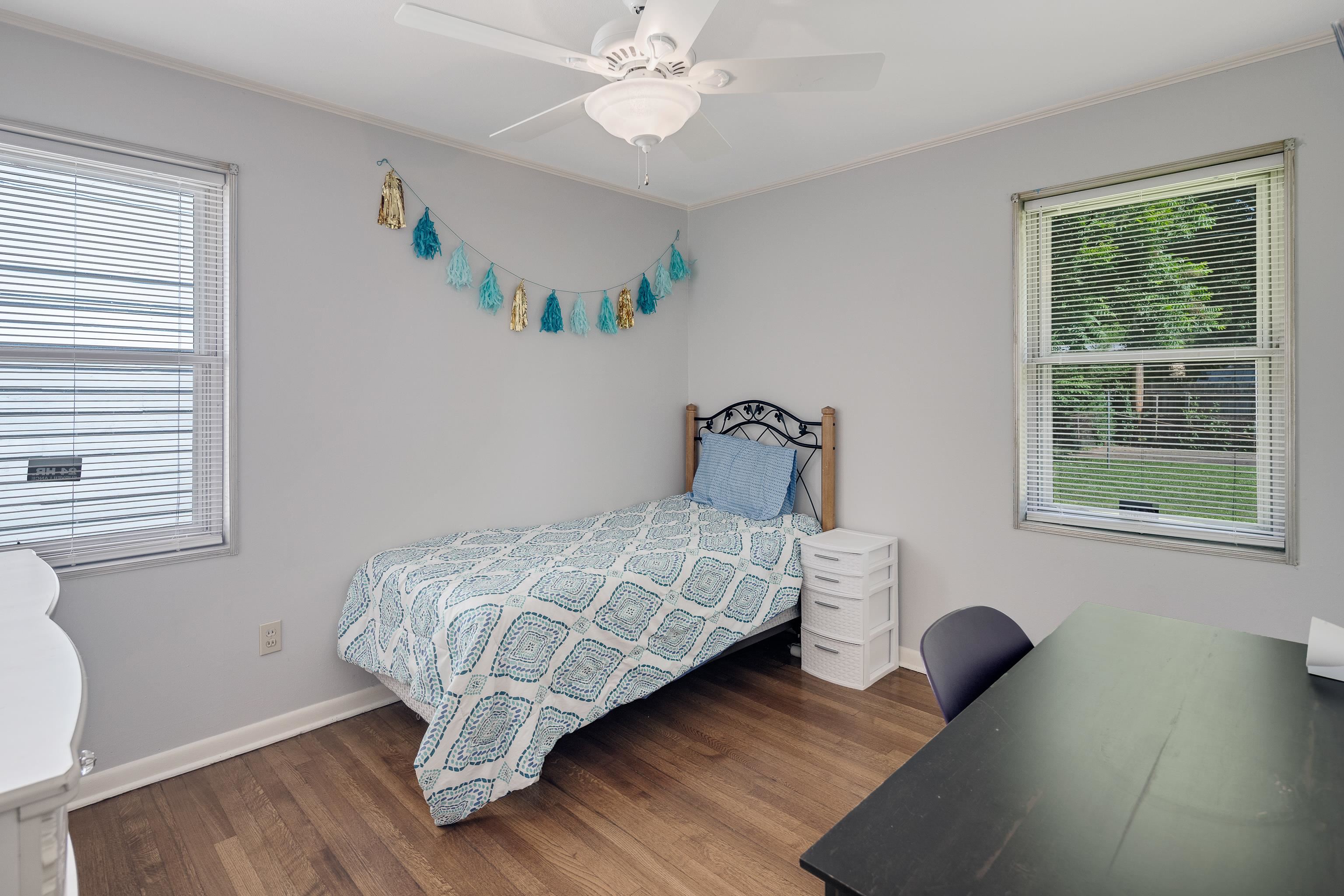 4796 Quince Road Memphis, TN 38117 - Photo 16 of 22 a bedroom with a bed and a window