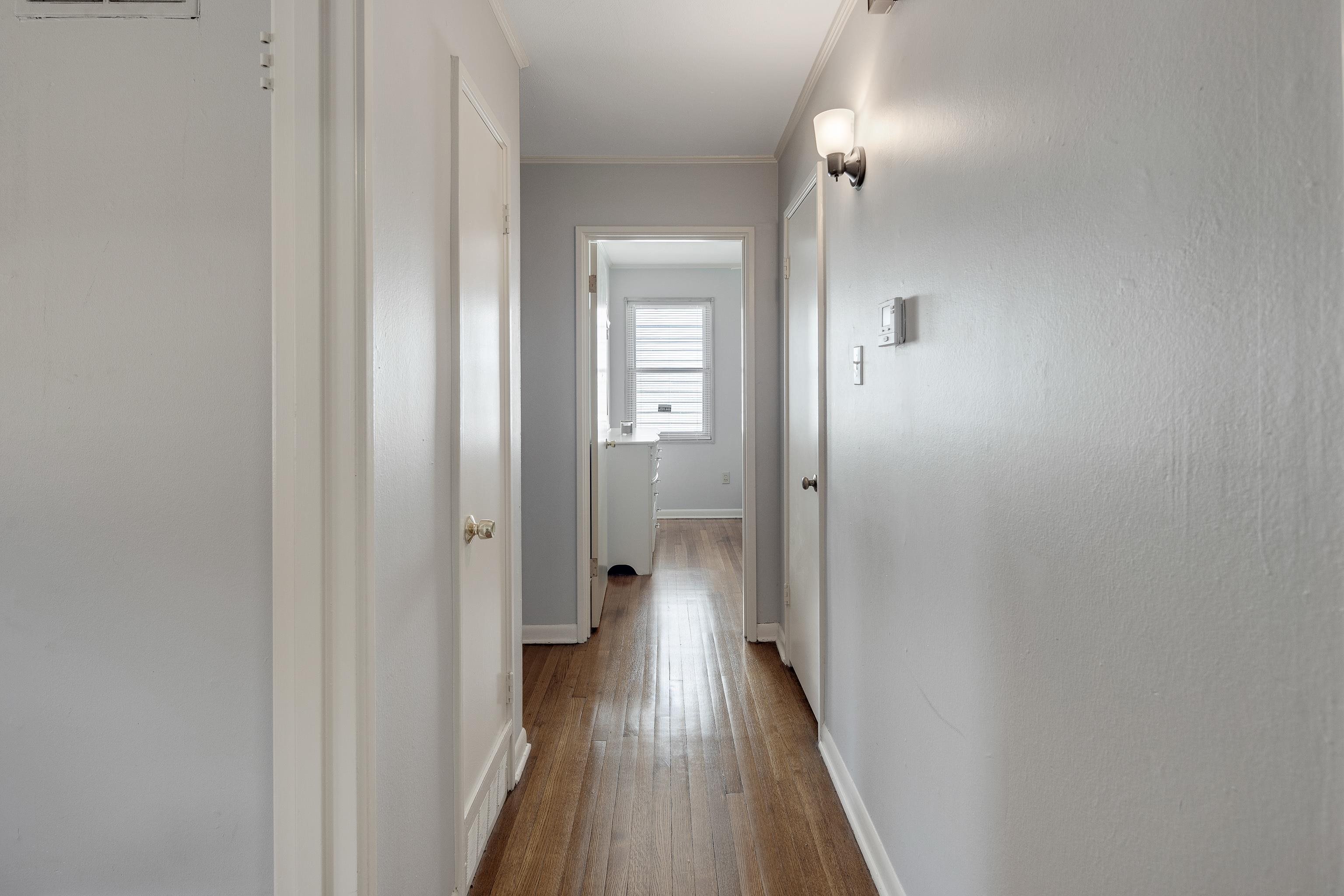 4796 Quince Road Memphis, TN 38117 - Photo 18 of 22 a view of a hallway with wooden floor