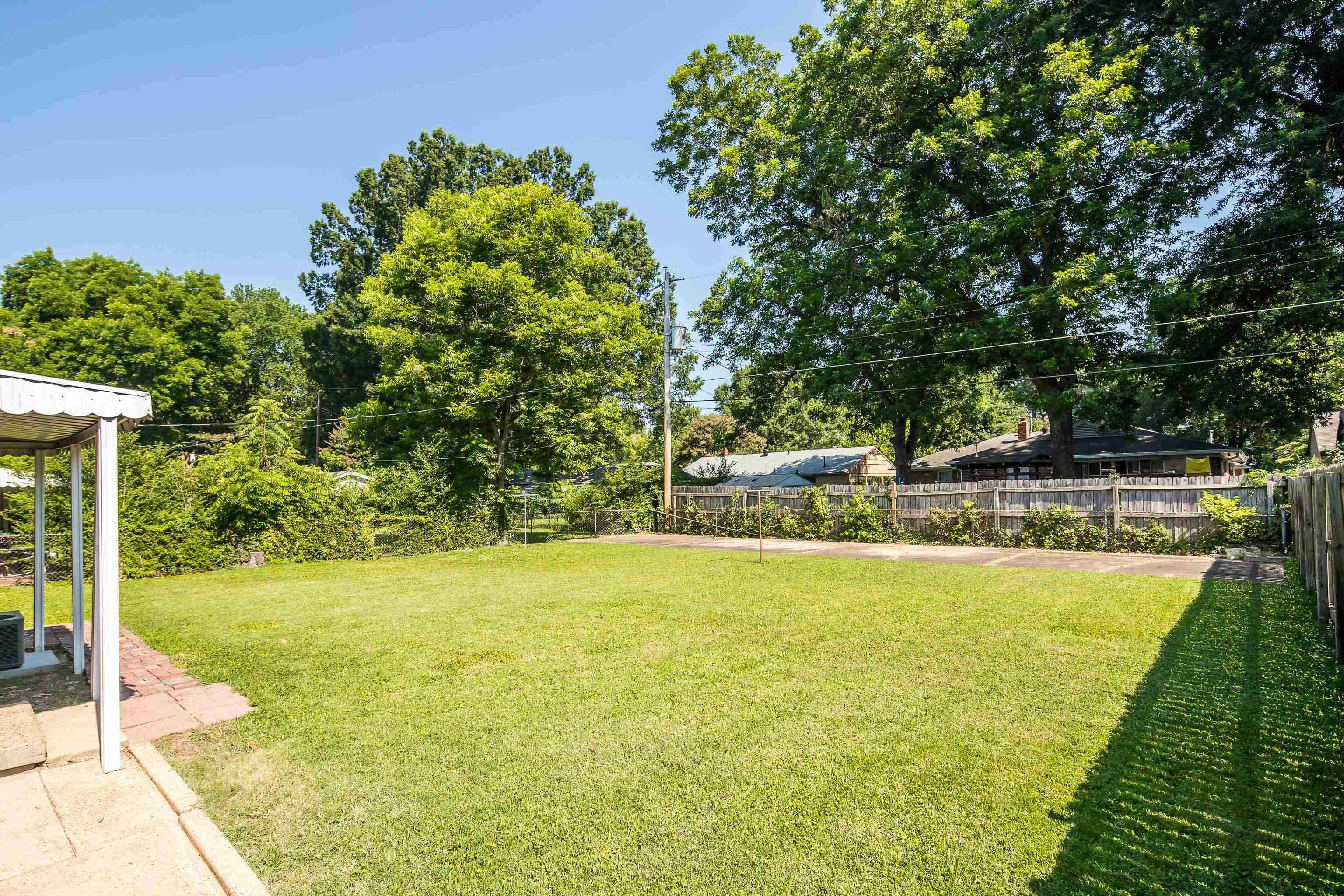4796 Quince Road Memphis, TN 38117 - Photo 20 of 22 a view of a swimming pool with an outdoor space and seating area