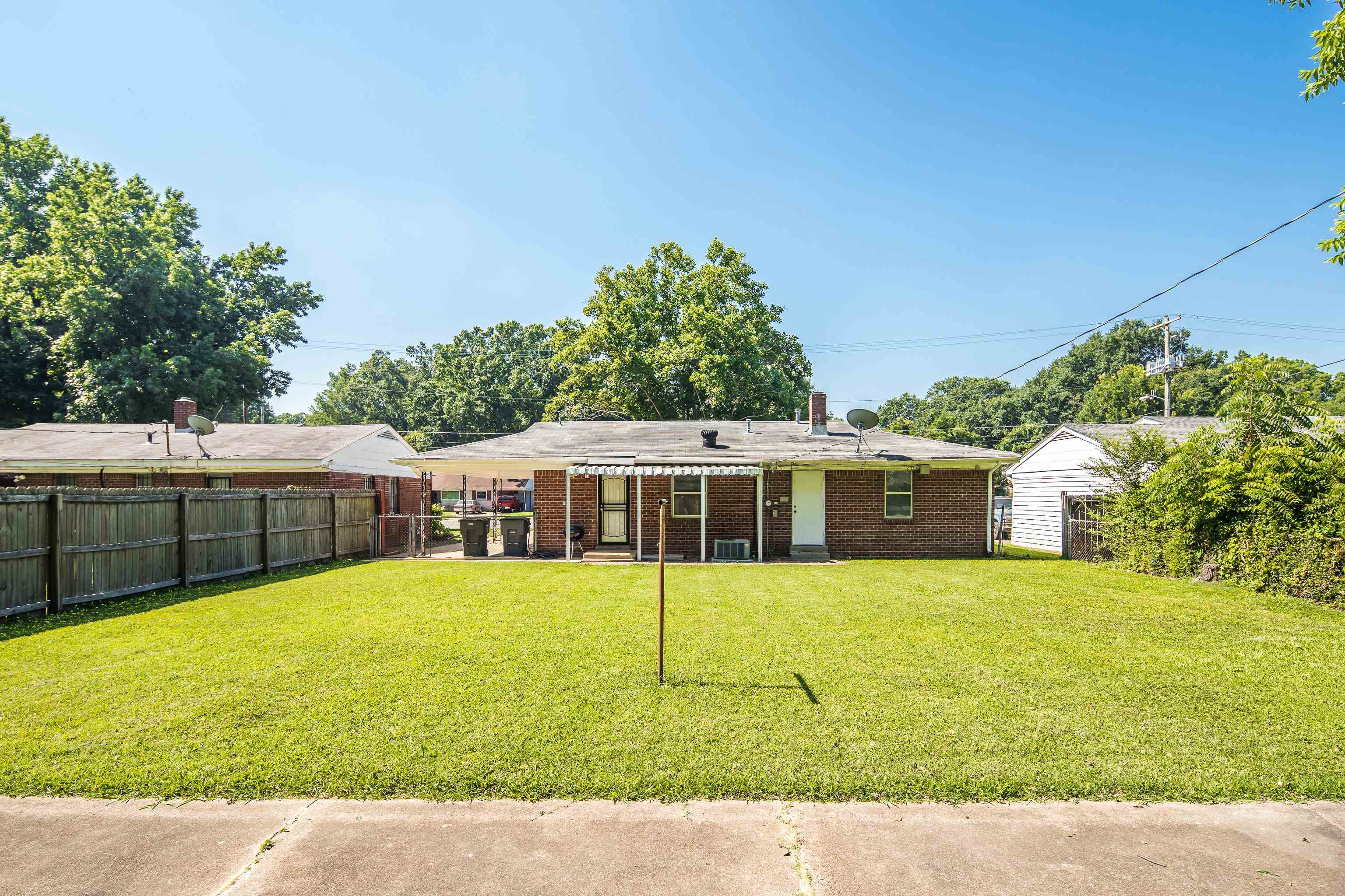 4796 Quince Road Memphis, TN 38117 - Photo 22 of 22 a view of a house with a yard