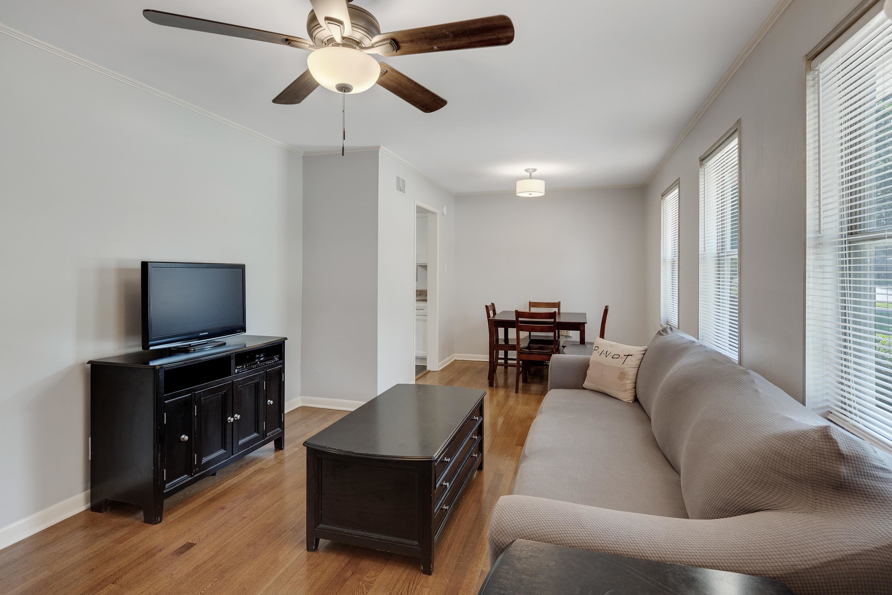 4796 Quince Road Memphis, TN 38117 - Photo 5 of 22 a living room with furniture and a flat screen tv