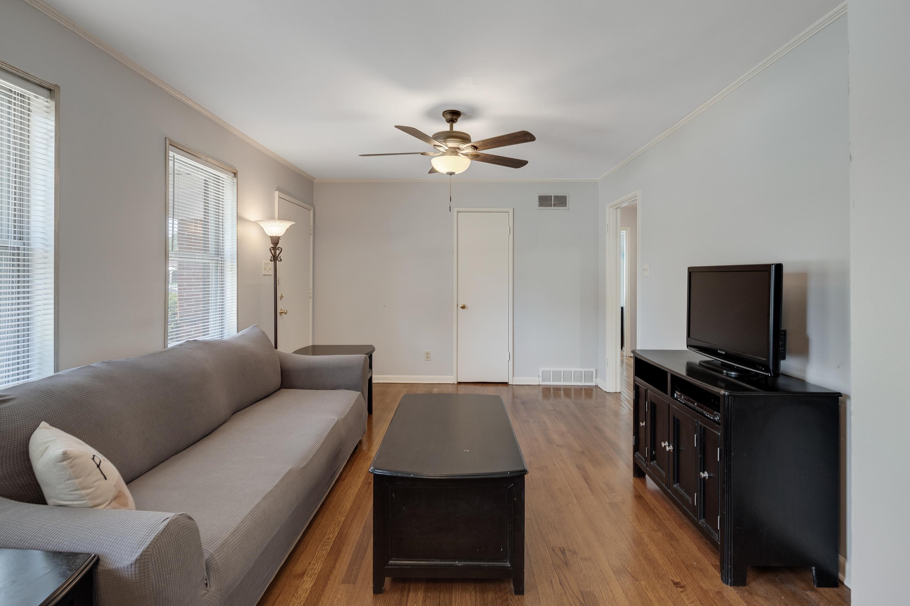 4796 Quince Road Memphis, TN 38117 - Photo 6 of 22 a living room with furniture and a flat screen tv