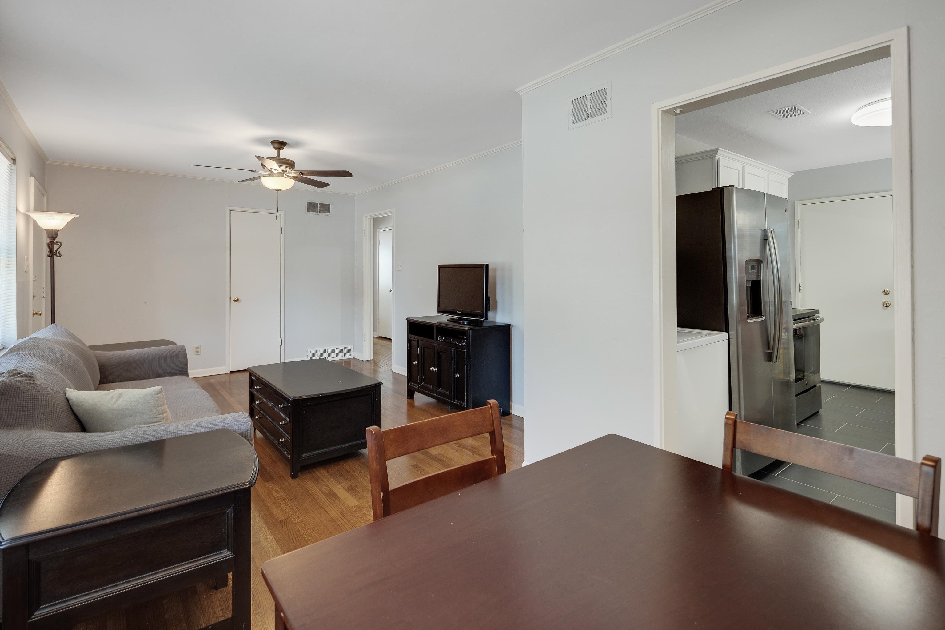 4796 Quince Road Memphis, TN 38117 - Photo 10 of 22 a living room with furniture and a flat screen tv