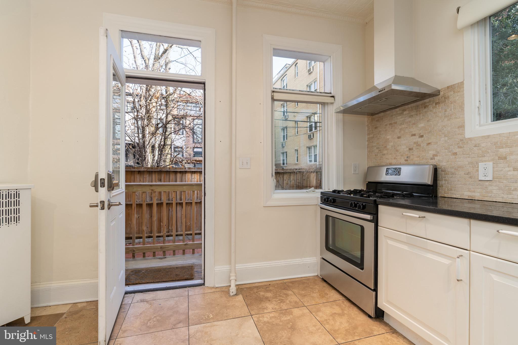 1827 S Street Northwest Washington, DC 20009 - Photo 18 of 50 Kitchen with access to rear terrace