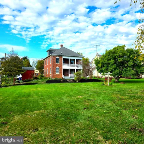 a stove top oven sitting inside of a kitchen