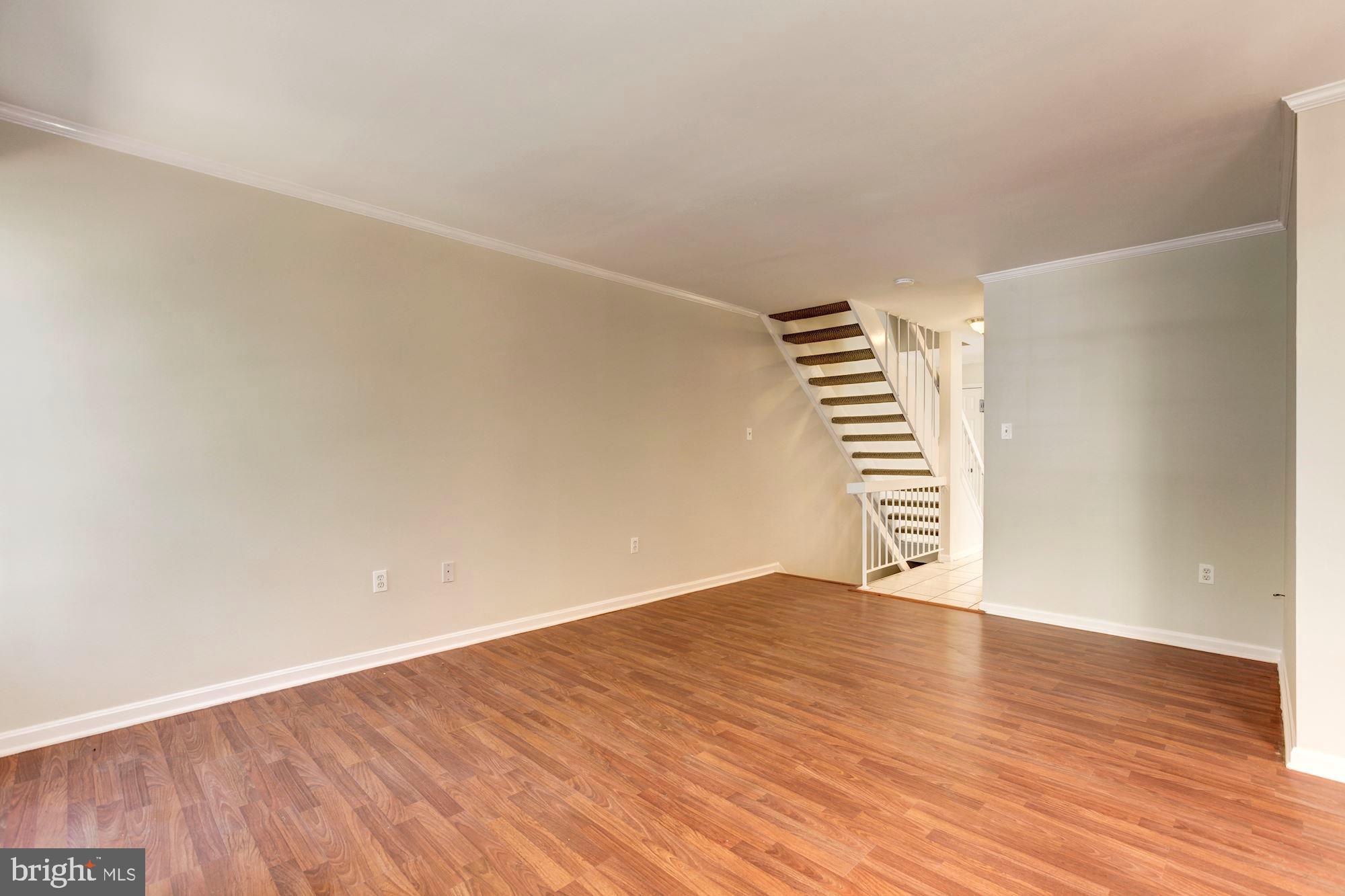 14518 MacBeth Drive Silver Spring, MD 20906 - Photo 17 of 43 a view of an empty room with wooden floor and a window