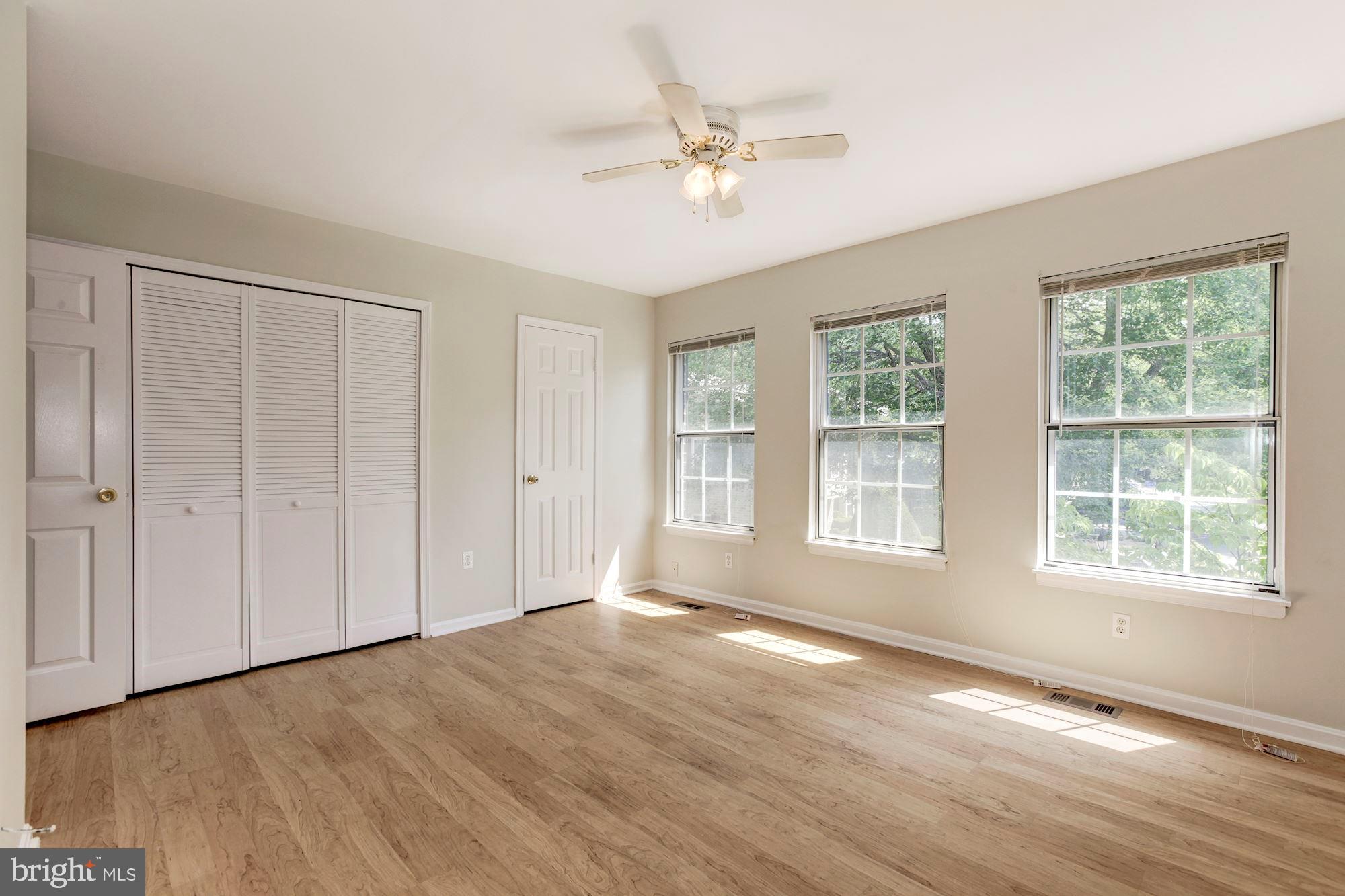 14518 MacBeth Drive Silver Spring, MD 20906 - Photo 23 of 43 a view of an empty room with a window and wooden floor