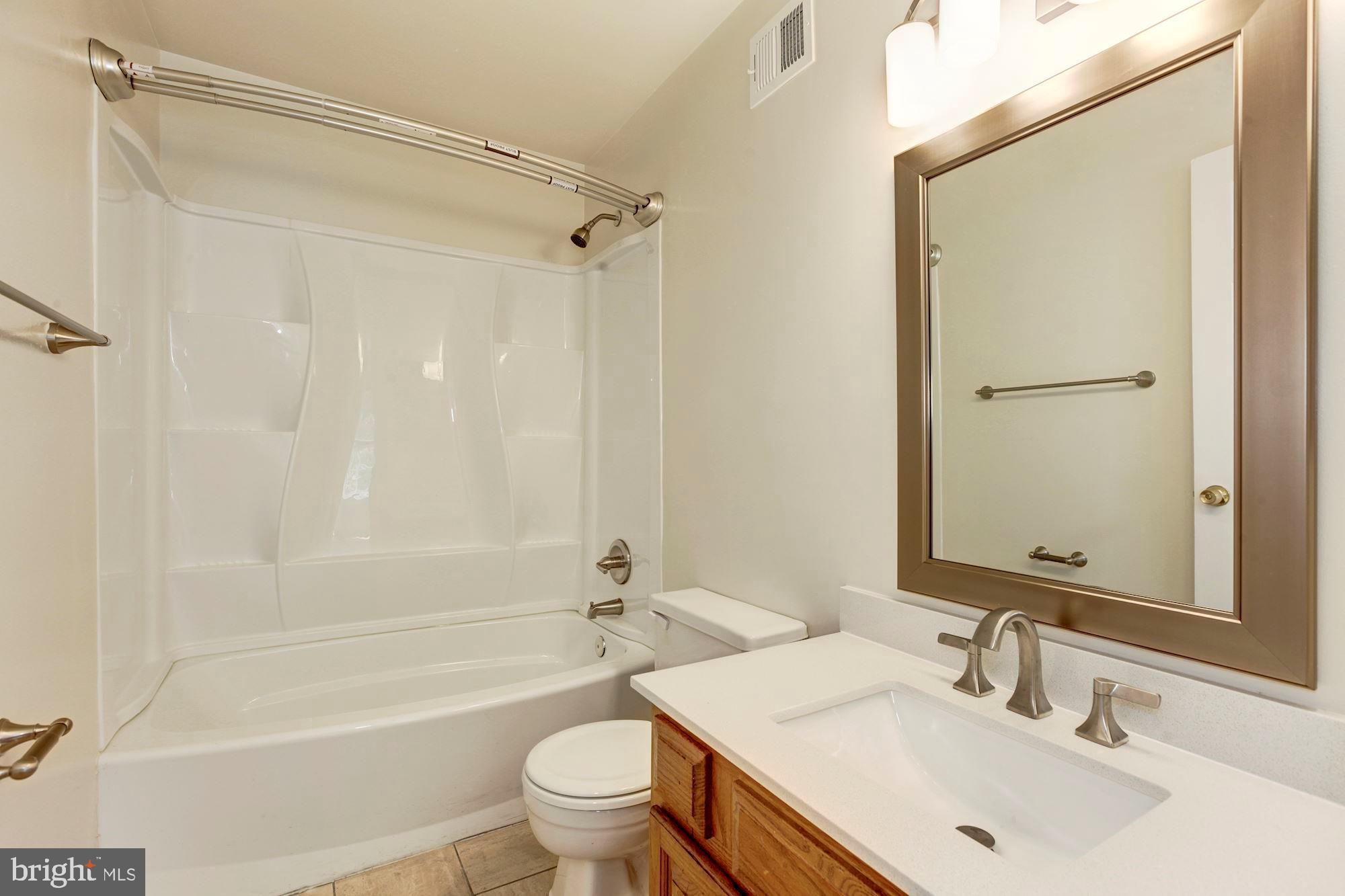 14518 MacBeth Drive Silver Spring, MD 20906 - Photo 26 of 43 a bathroom with a sink toilet and shower