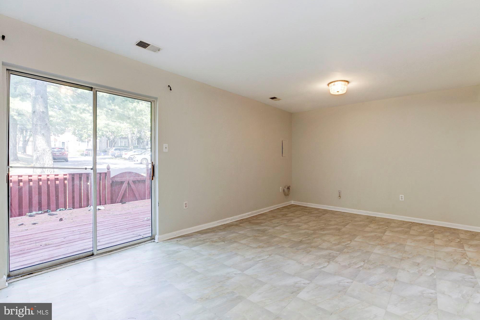 14518 MacBeth Drive Silver Spring, MD 20906 - Photo 34 of 43 an empty room with wooden floor and windows