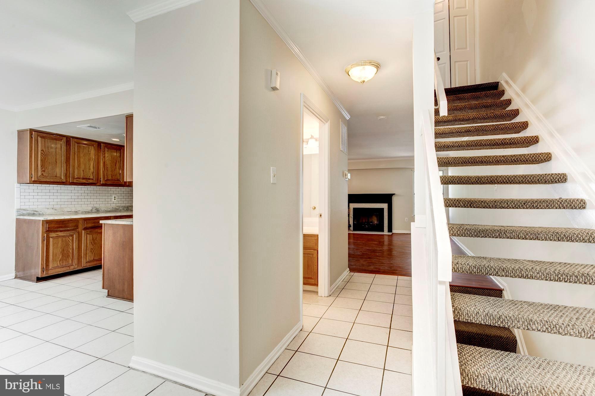 14518 MacBeth Drive Silver Spring, MD 20906 - Photo 5 of 43 a view of a hallway with stairs and furniture